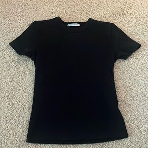 Winens black Zara ribbed T shirt. Fits tightly. Never worn.